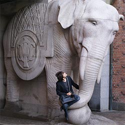 Me setting on a elephant's statue's trunk